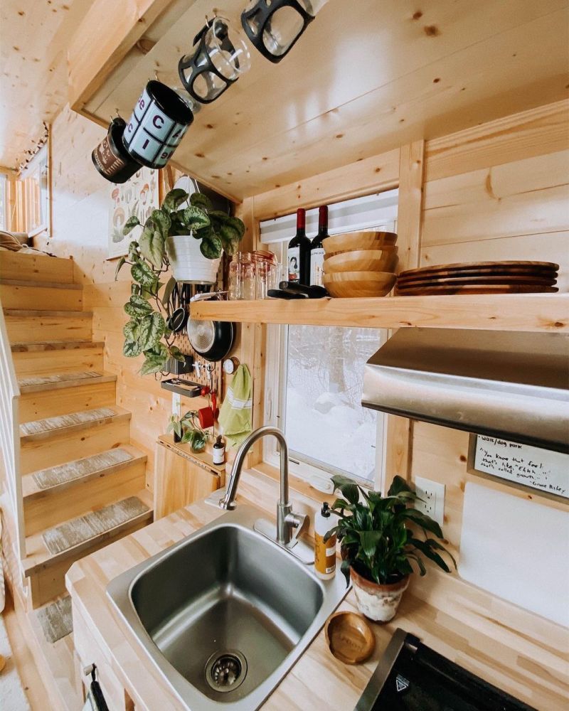 There's lots of creative storage solutions incorporated all throughout this tiny house