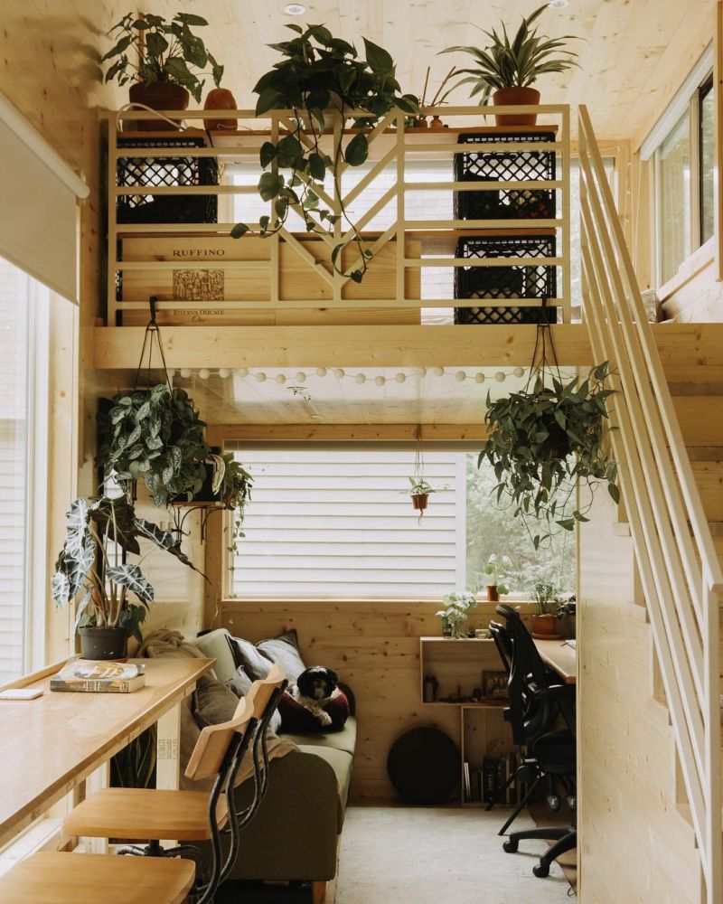 A cozy desk area takes up this side of the house and it gets plenty of natural light through the small windows