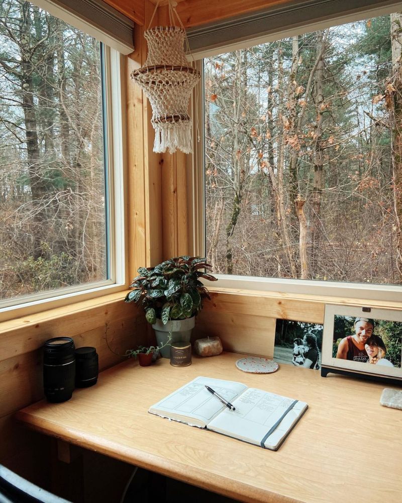 Lots of potted plants, decorations and little details are scattered all throughout this tiny house giving it lots of character