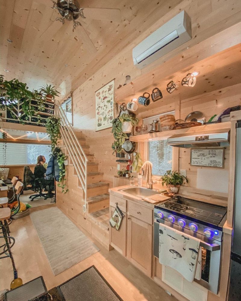 Although this tiny house is packed with furniture and decorations, it feels airy and spacious on the inside