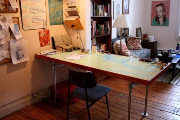 Diy desk of salvaged door and pipes1