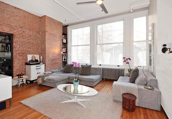 Exposed brick white walls neutral gray furniture