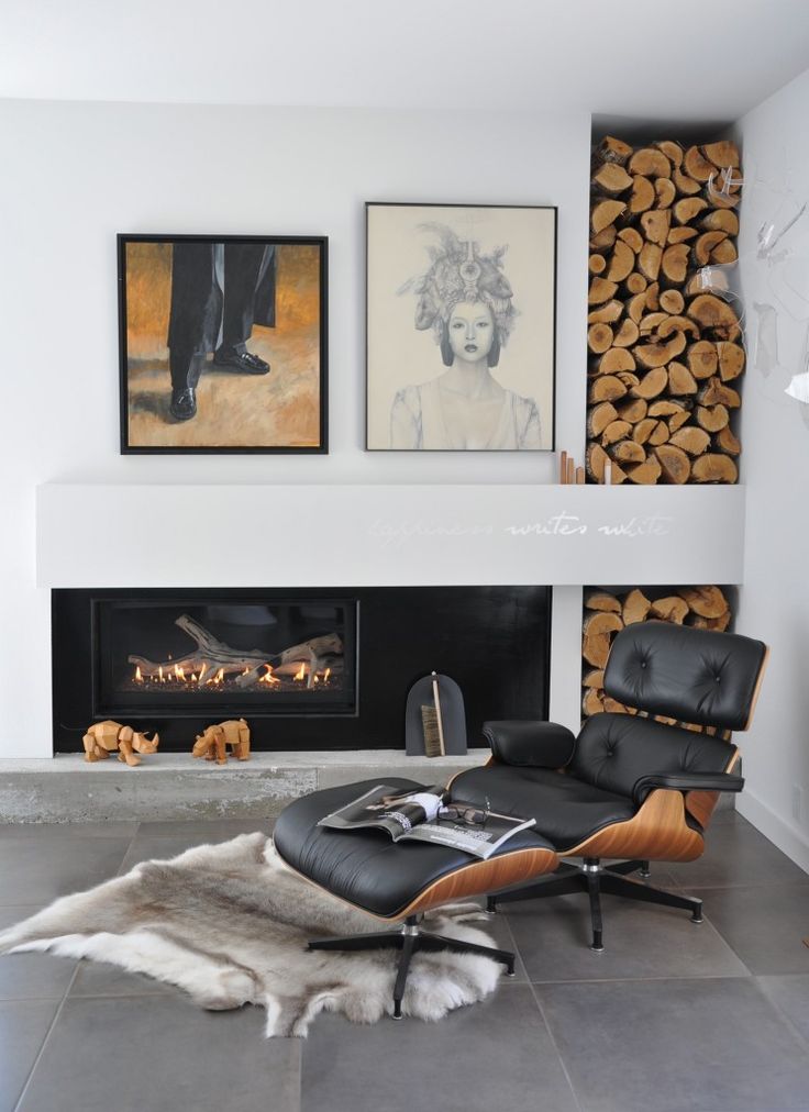 Fireplace reading corner iconic eames chair and firewood storage