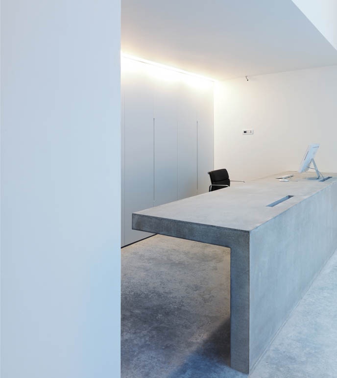 Floating concrete reception desk