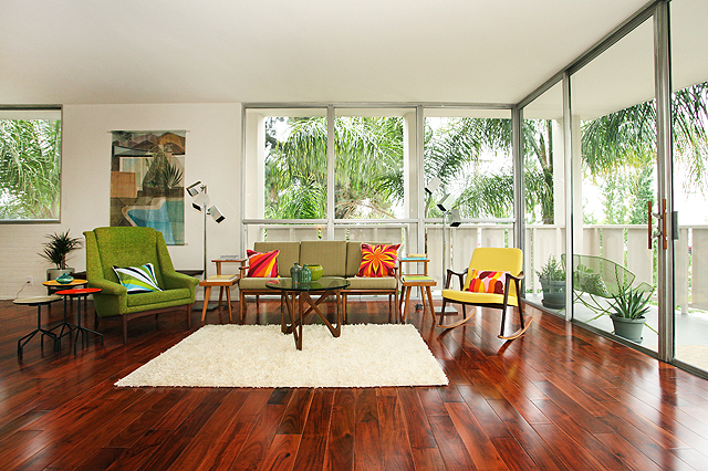 Floor to ceiling glass wall midcentury furniture