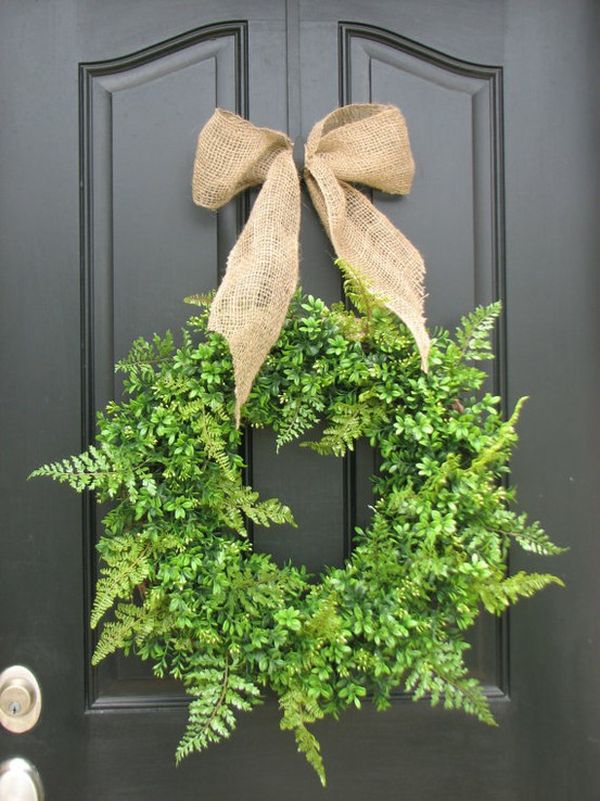 Fresh wreath decorated with burlap