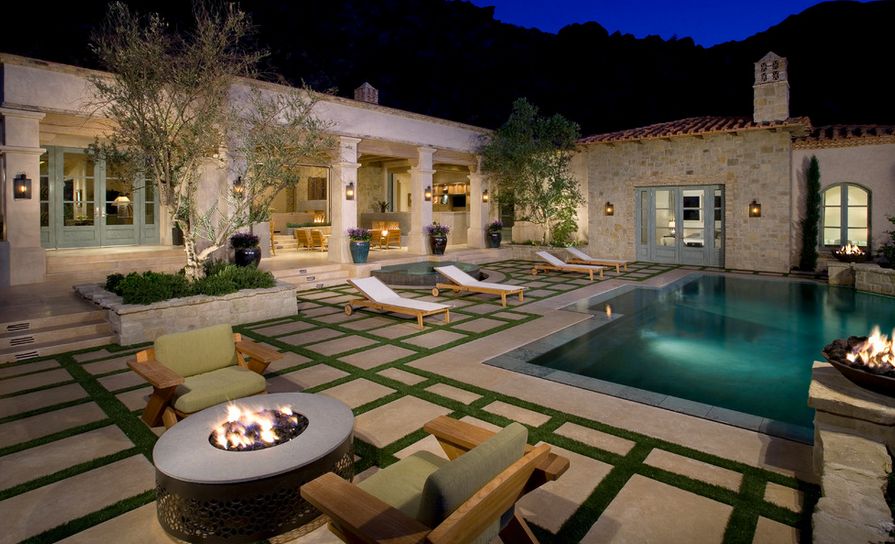 grass-and-concrete-pavers-around-pool