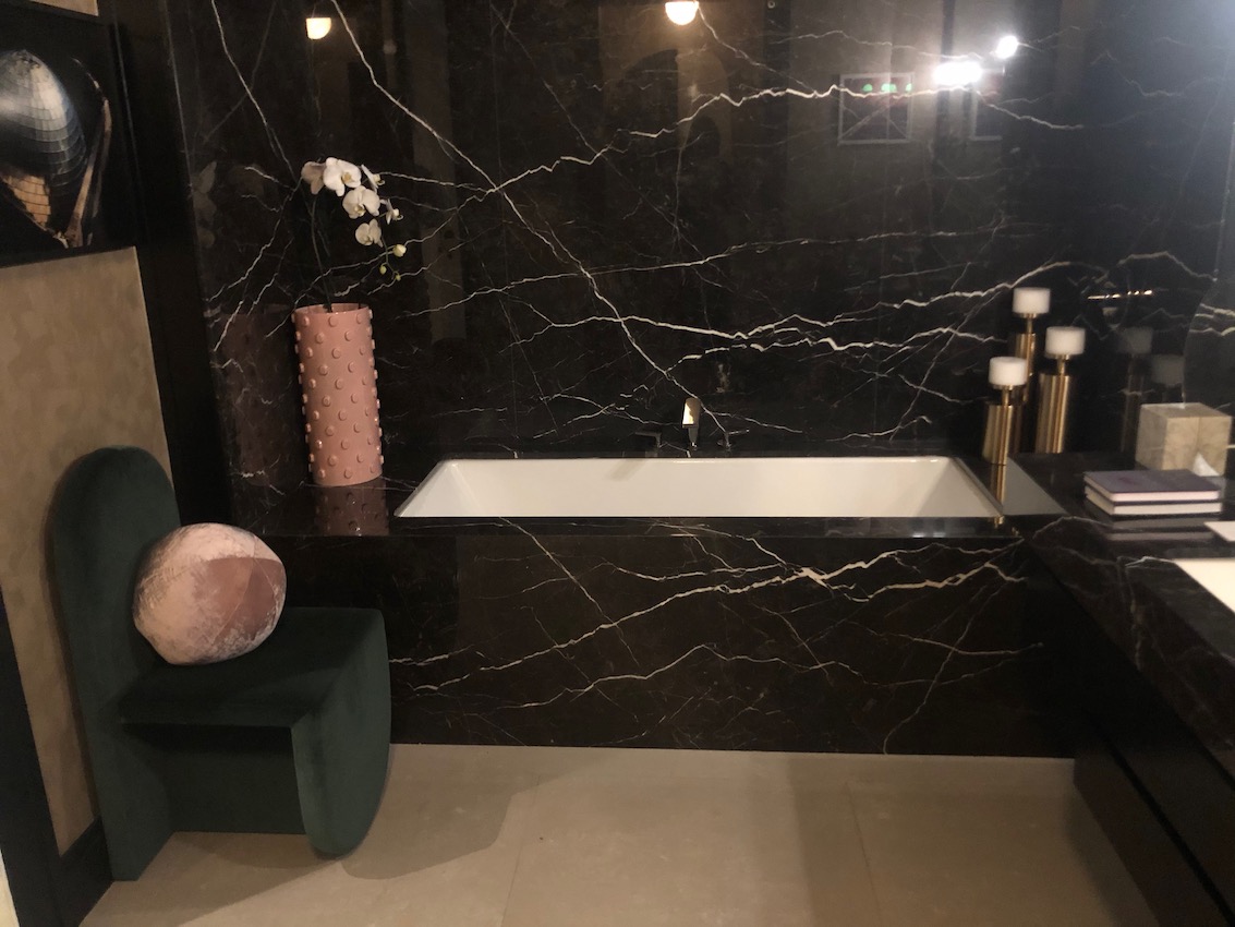 Holiday house black marble bath