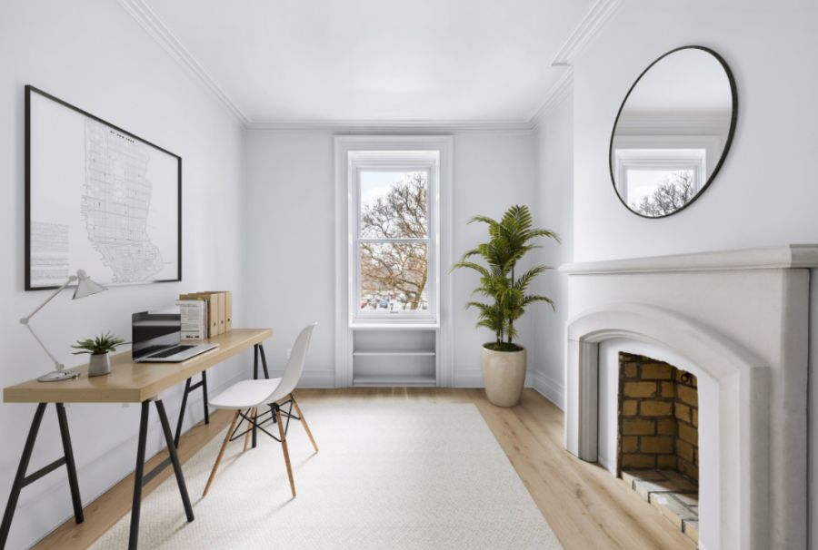 Home studio in New York with gray walls and fireplace