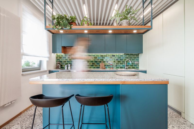 Blue upper cabinets and kitchen island