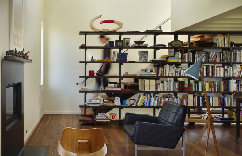 large bookcase that doubles as a partitio