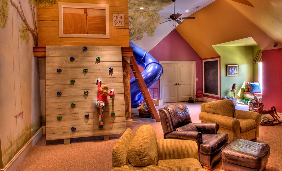 Large room for kids with climbing wall and slide