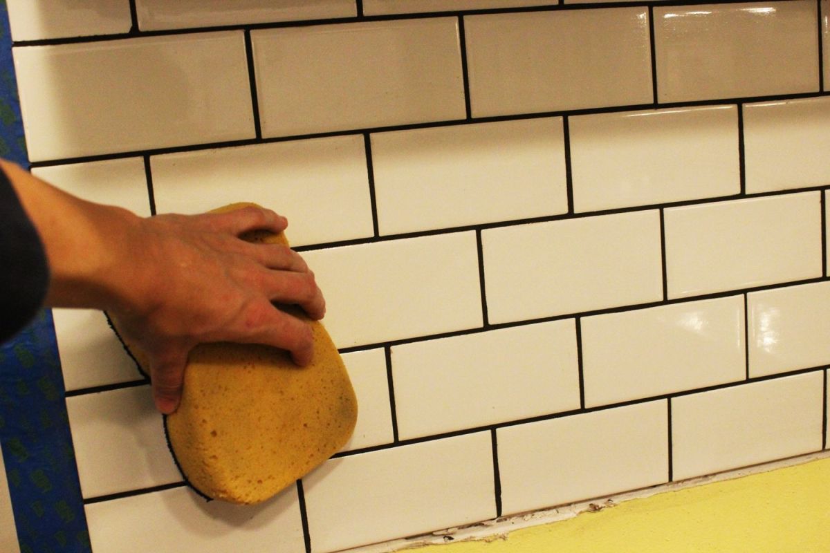 leaving most of the grout in the spaces
