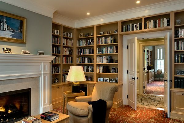 Living room fireplace and books around door