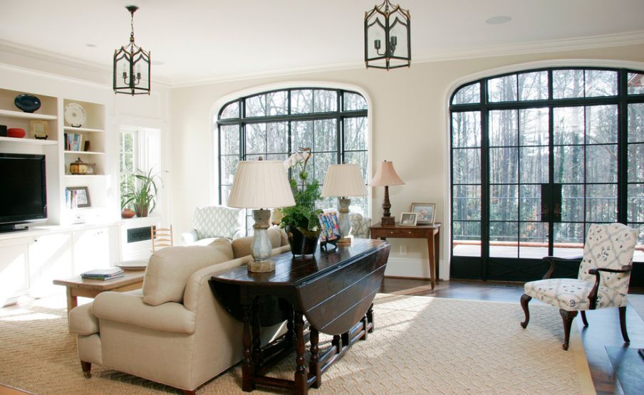 Living room with drop leaf table behind sofa