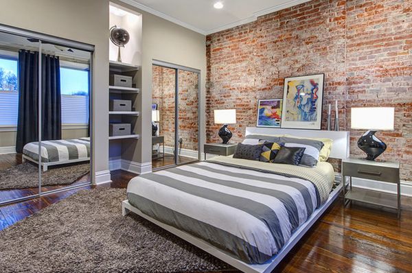 Modern bedroom featuring an exposed bricks wall