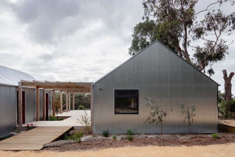 Modern home corrugated metal siding backyard