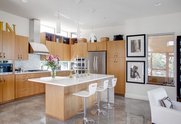 Modern kitchen with concrete floor and brown cupboards