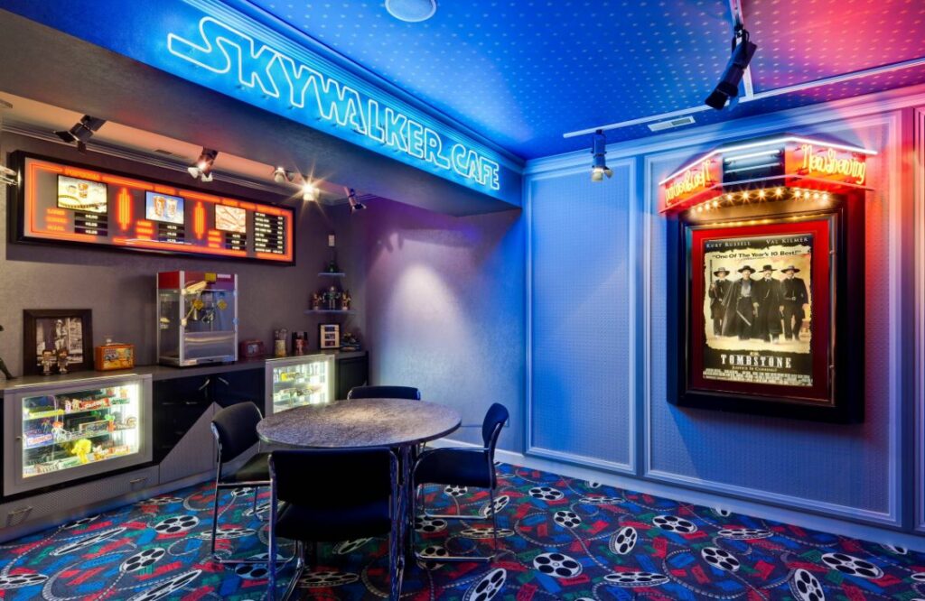 Neon lights in theater room with star wars and tombstone poster 1024x666