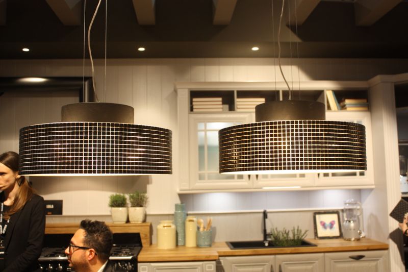 At the other end of the design spectrum are these shiny, modern drum lights, also exhibited by Arrex. Again used in a pair as kitchen island lighting, the pendants also would be appropriate over a dining table.