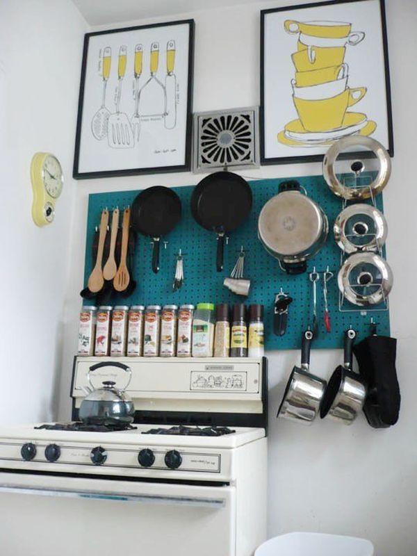 Pegboard wall storage above stove