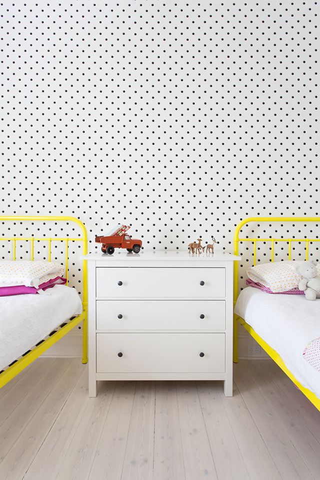 Polka dots wallpaper for shared bedroom yellow frame bed