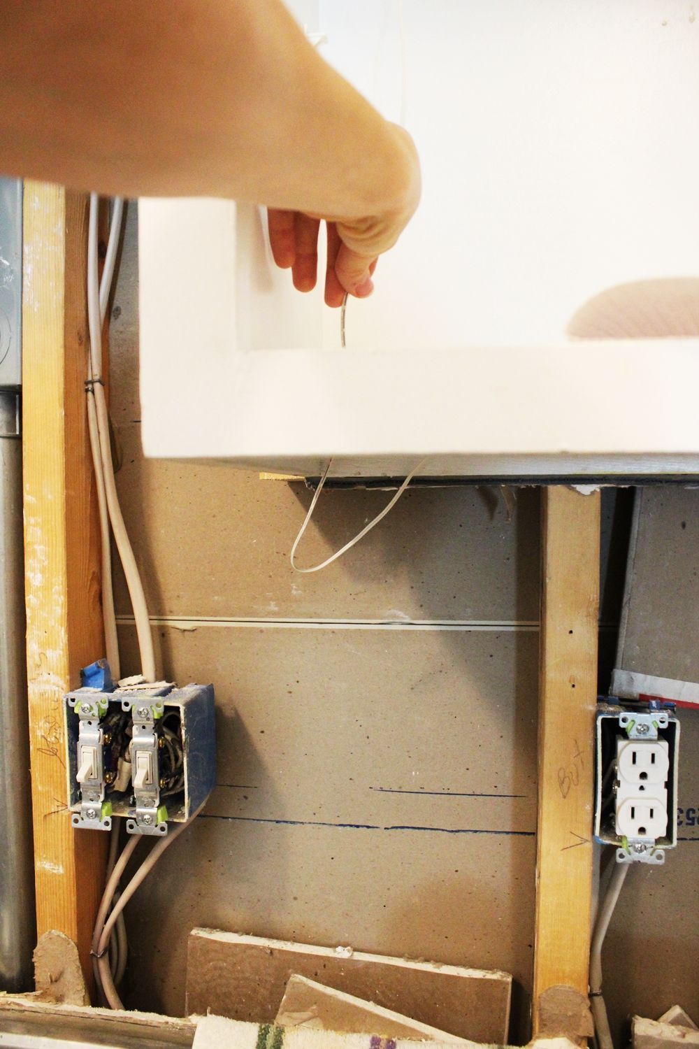 pull the excess wire up through the cabinet bottom
