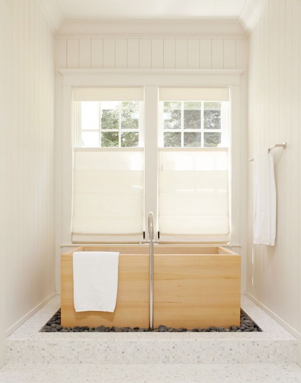 Rocks around wooden rectangular bathtub