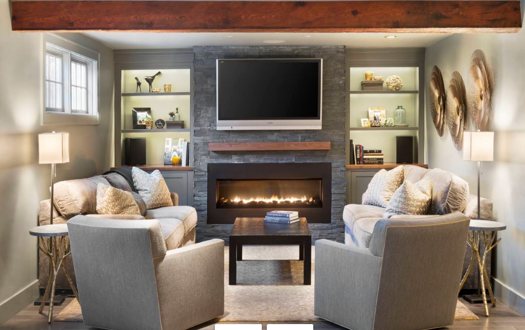 Small family room with tv above fireplace