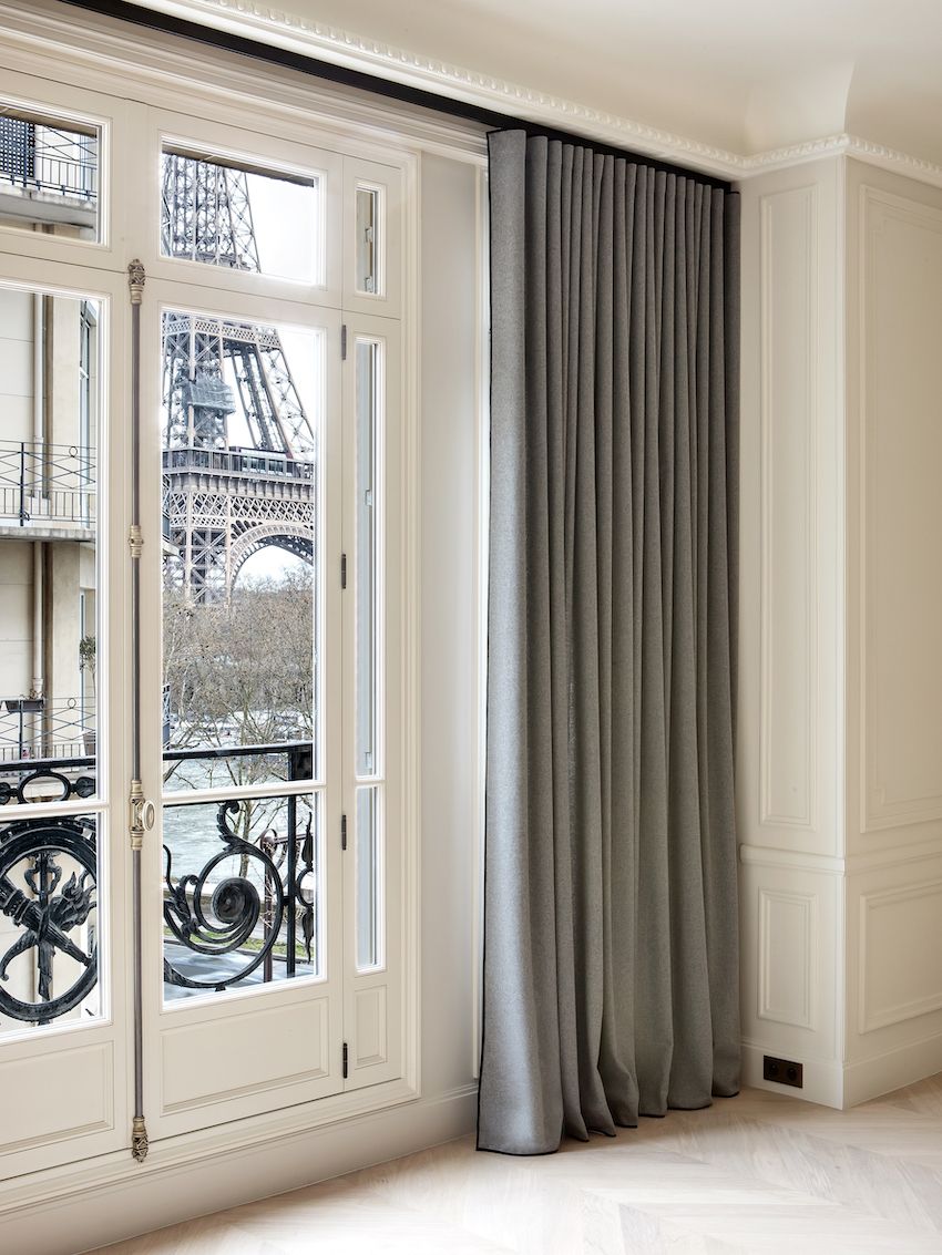 Stylish Parisian apartment large living room drapes