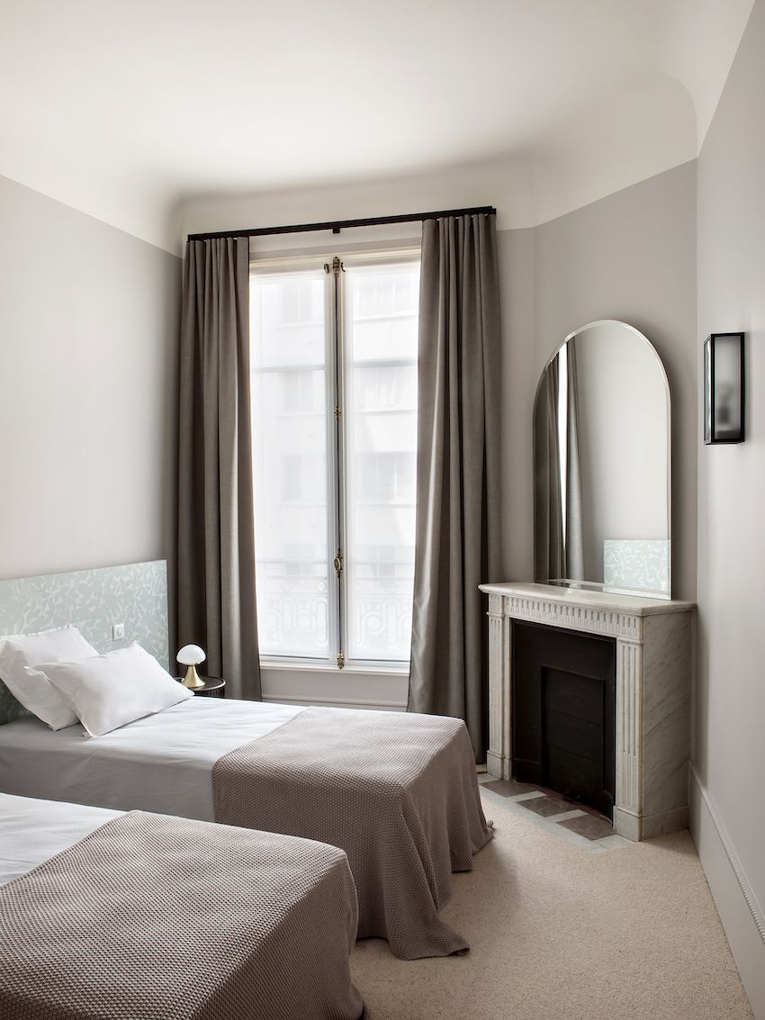 Stylish Parisian apartment twin beds