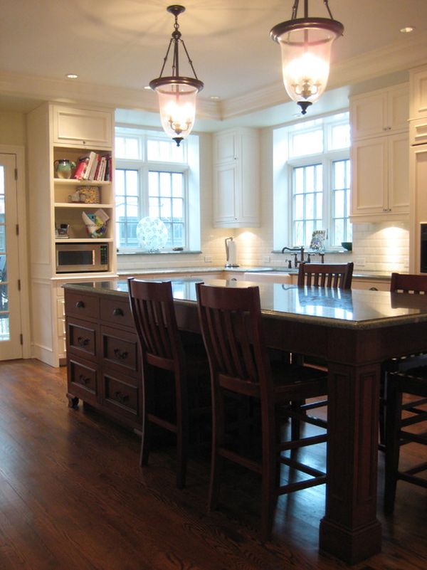 This is an elegant kitchen island that also serves as a table