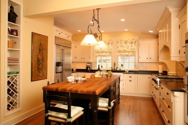 Kitchen island with storage on one end and a breakfast space on the other