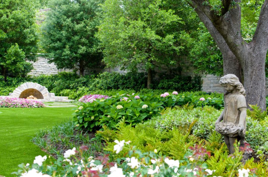 Traditional landscaping in Dallas with a fireplace