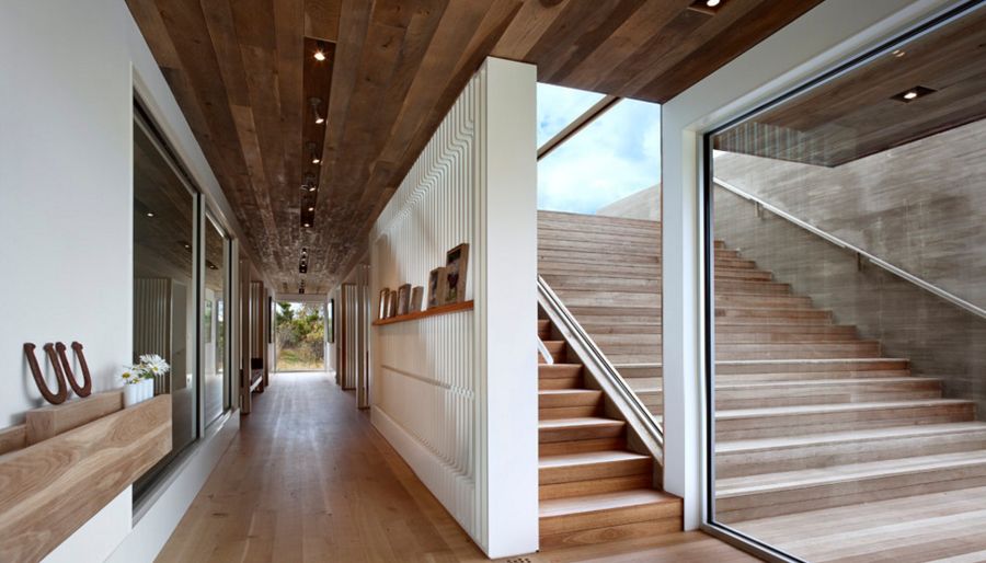 two staircases are connected by glass walls