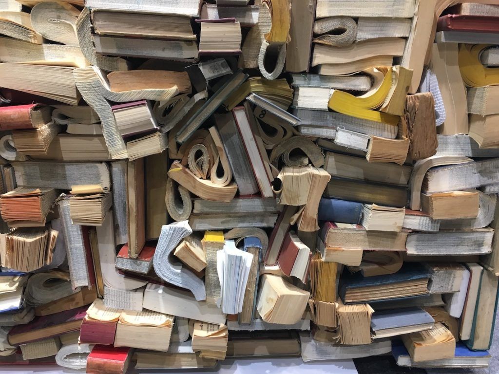 Carved, curled, trimmed and tucked, discarded books go into a fun texture-scape instead of the landfill.