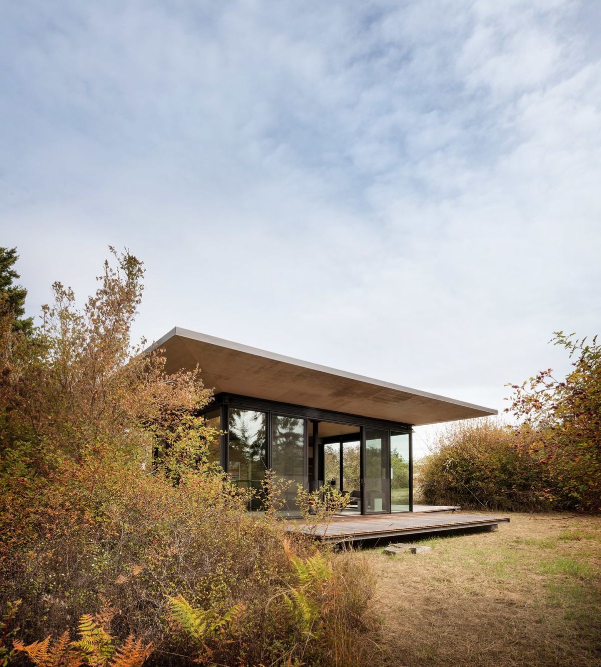 Waterfront home in the Pacific Northwest by Olson Kundig outdoor porch