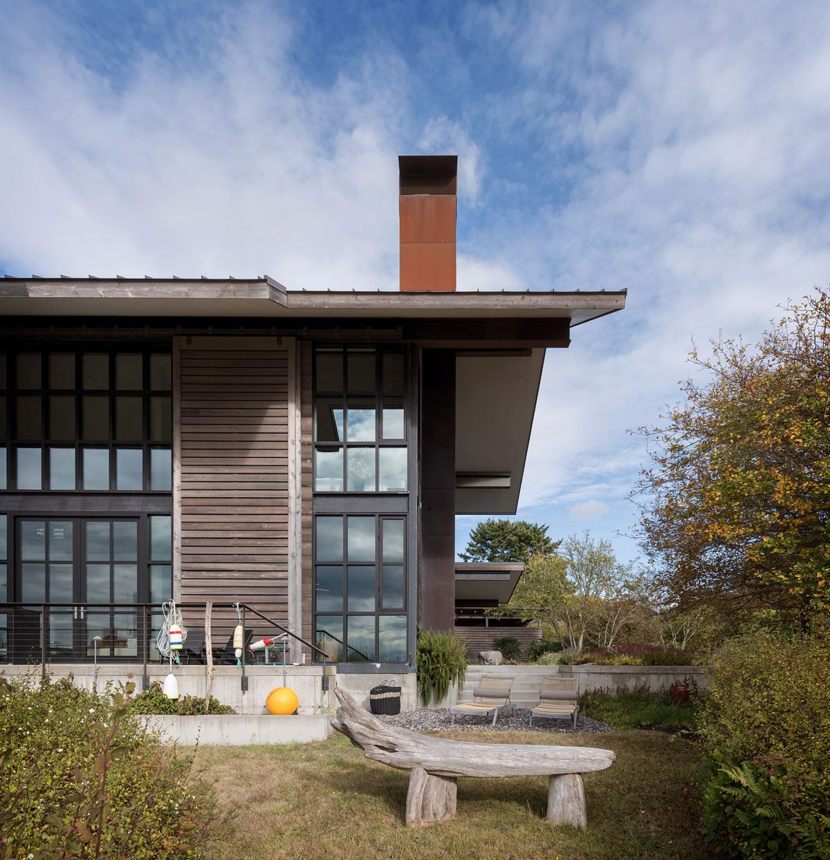 Waterfront home in the Pacific Northwest by Olson Kundig wood seating