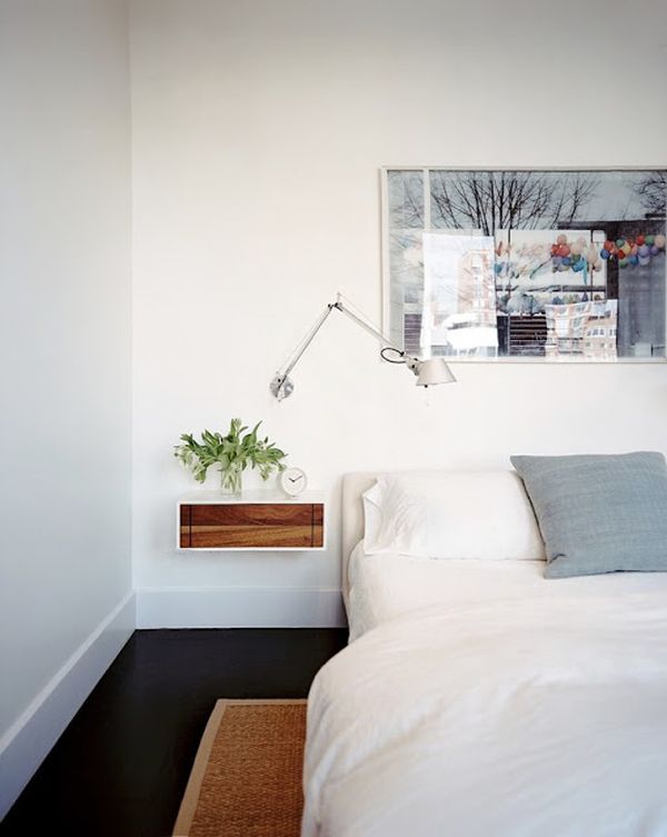 White bedroom design with dark floor and floating stand