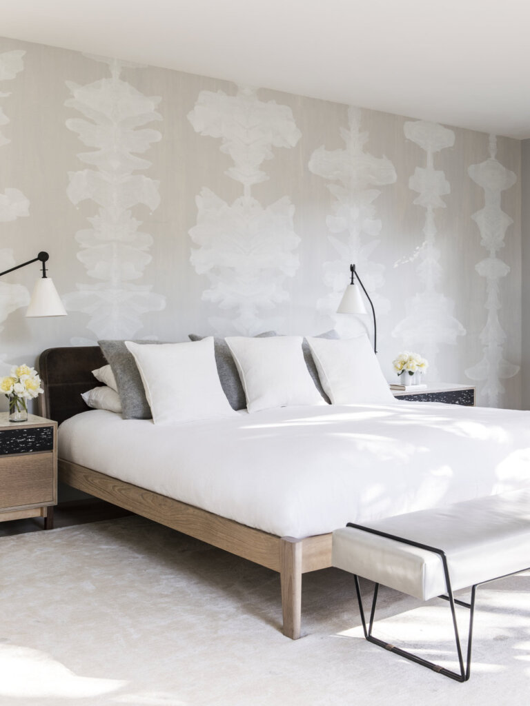 White bedroom with aptterned wall