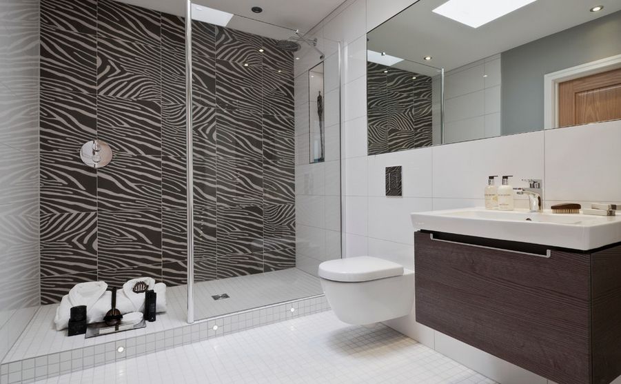 White floor tiles and animal tiles shower wall mounted toilet