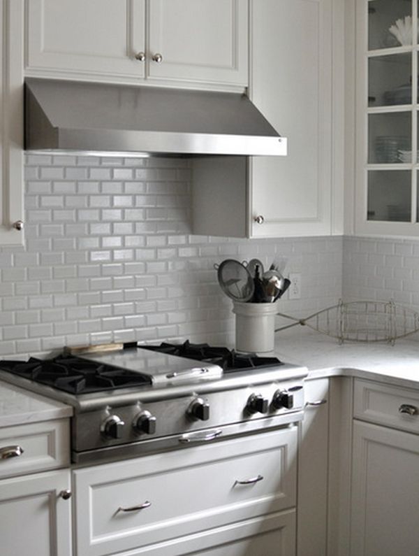 White kitchen subway tiles backsplash and matching cabinets