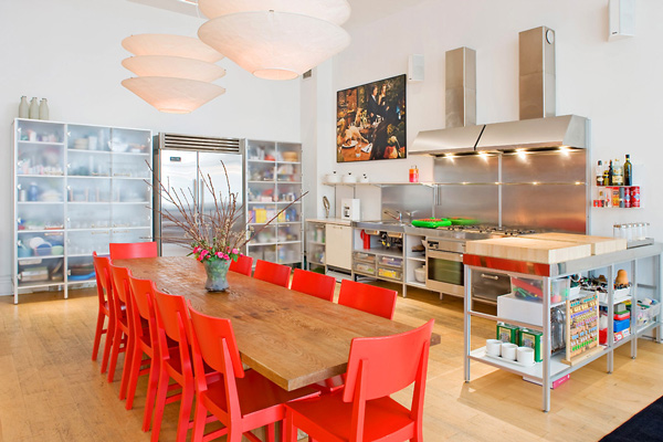 White kitchen walls red chairs