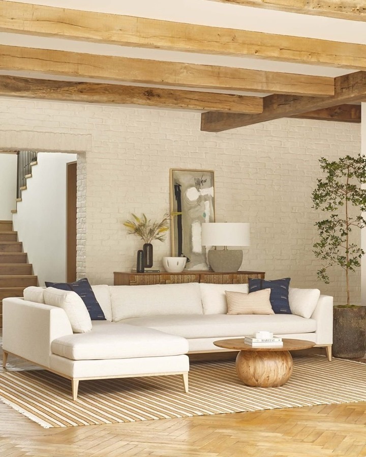 White sectional with exposed beams