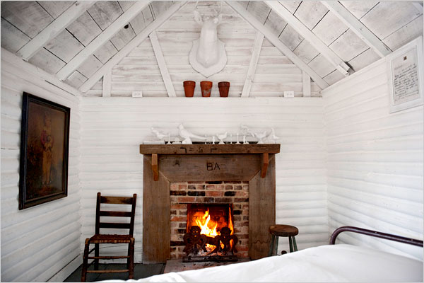 White walls cabin style fireplace