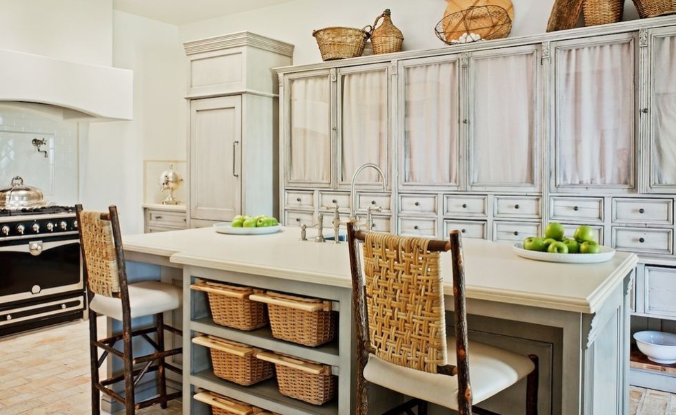 wicker baskets under kitchen island for storage