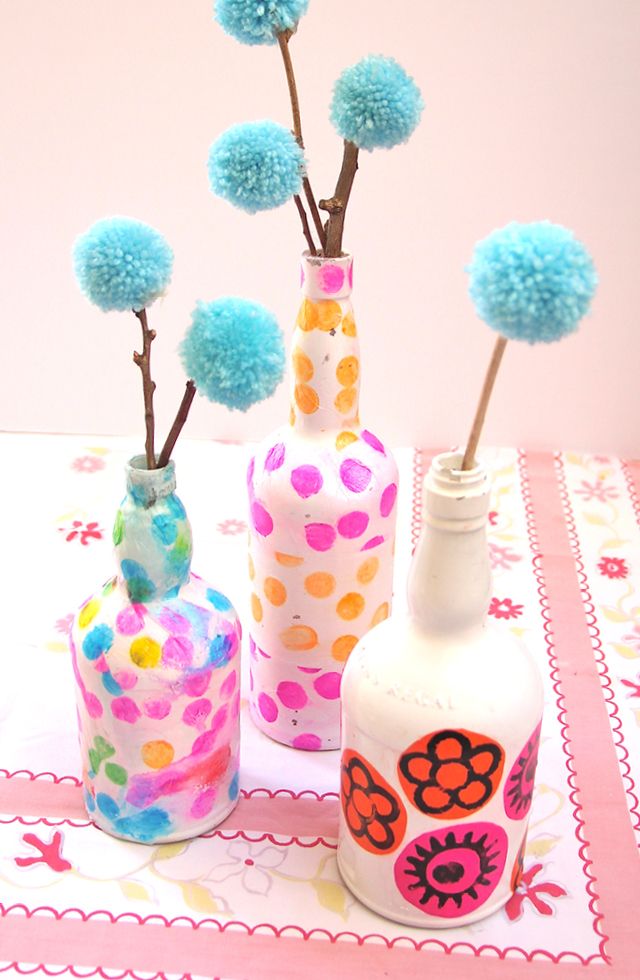 Wine bottle vases decoupaged with tissue paper