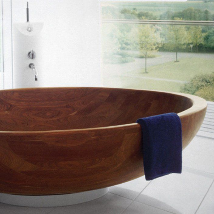 This substantial bowl of a wooden bathtub is by WS Bath Collections. It is available in a number of wood varieties: Larch, Beach, Mahogany, Cedar, Walnut, Cherry, Wenge, or Teak