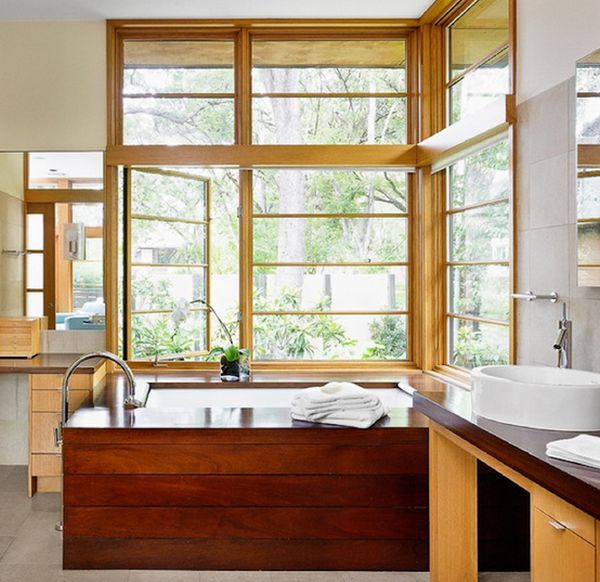 Wooden bathtub closer to window