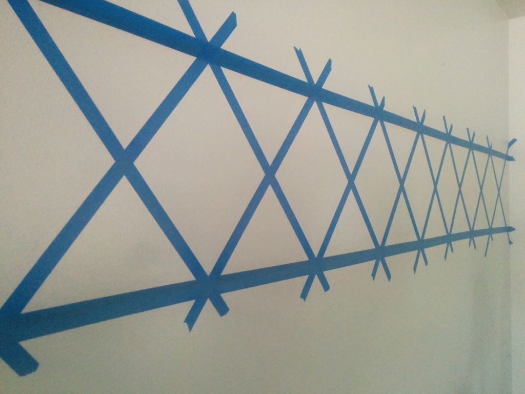 X mark painters tape on wall 1